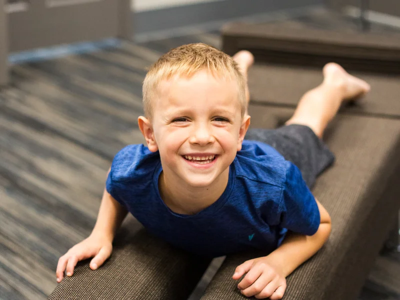 A young patient on the adjusting table at Full Circle Health