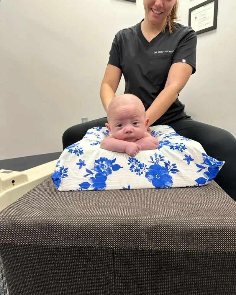 Dr. Noonan giving a gentle adjustment to an infant at Full Circle Health