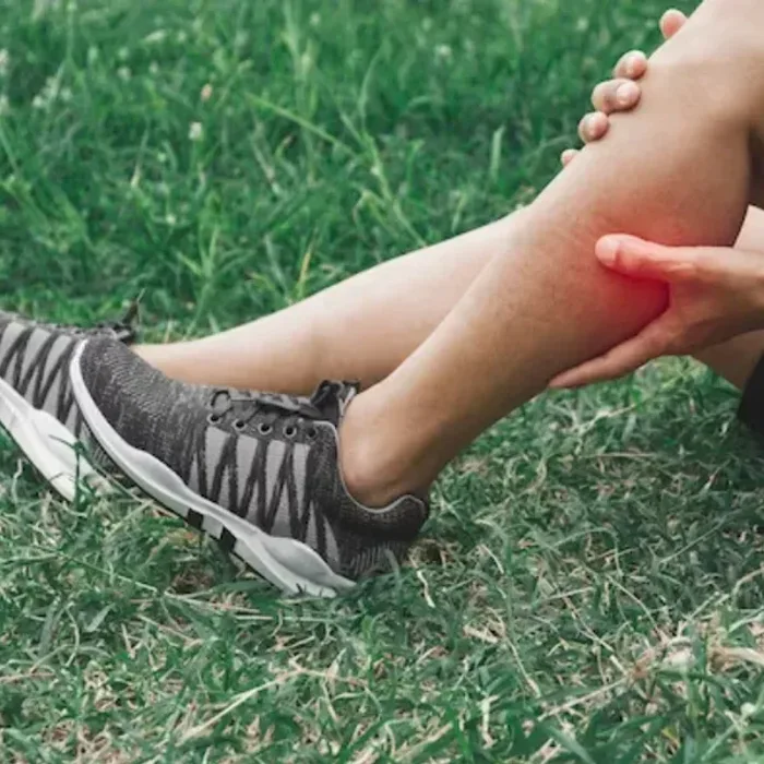 Runner holding a painful lower leg