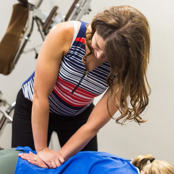 Dr. Noonan treating a patient’s hip and pelvis at Full Circle Health