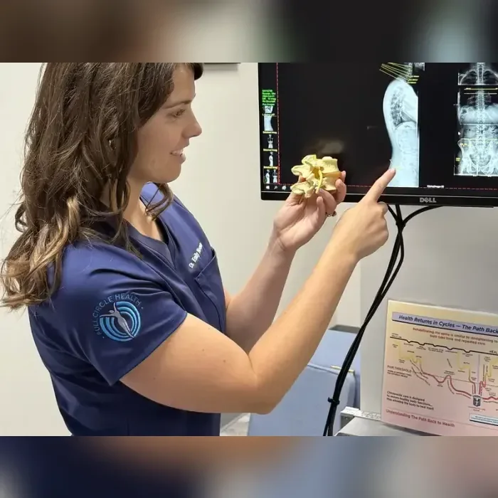 Reviewing spinal imaging with a patient at Full Circle Health in Chesterfield